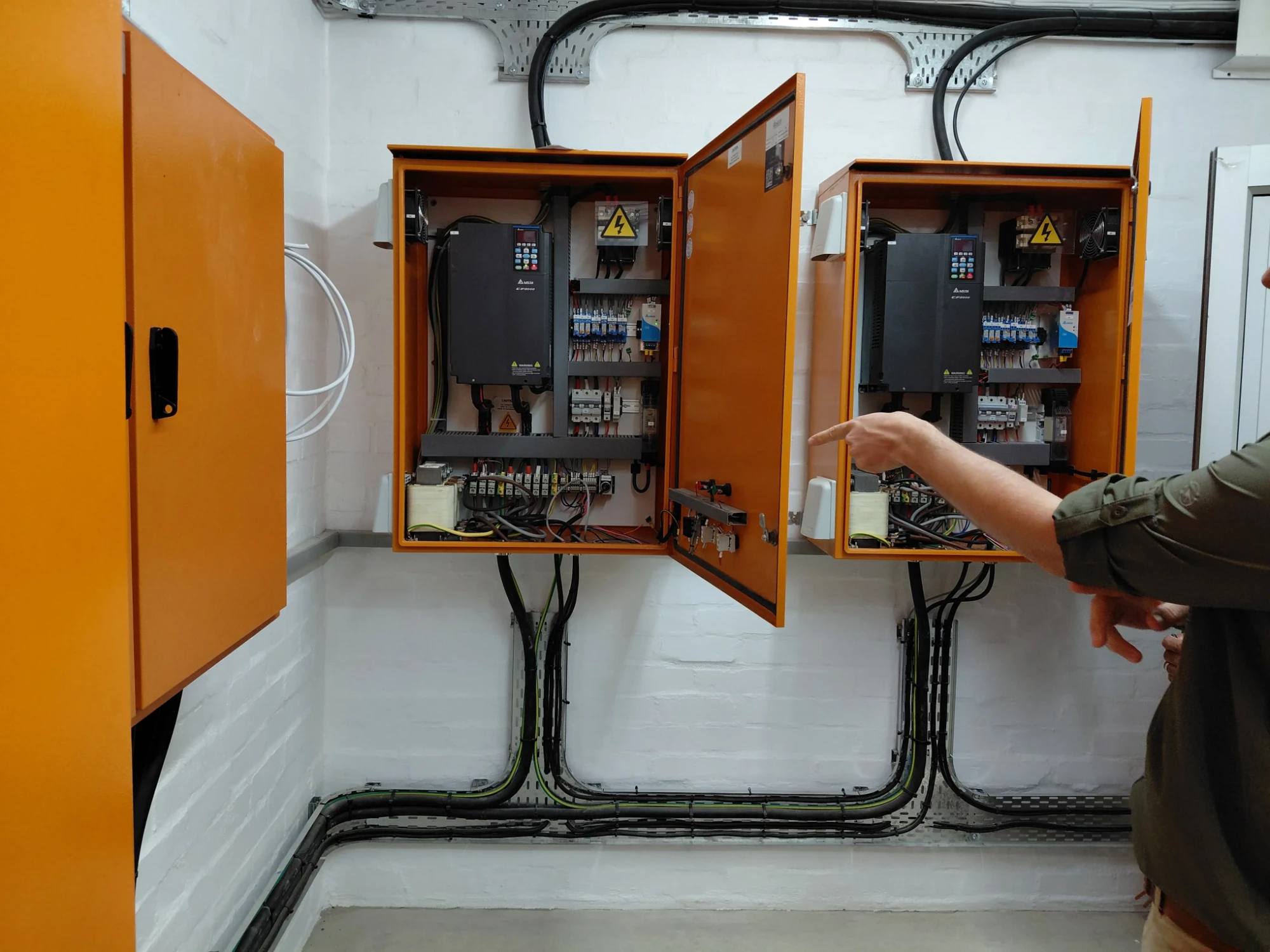 Open control panels housing variable speed drives that regulate irrigation pump motors